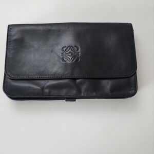 Loewe leather clutch with suede interior.